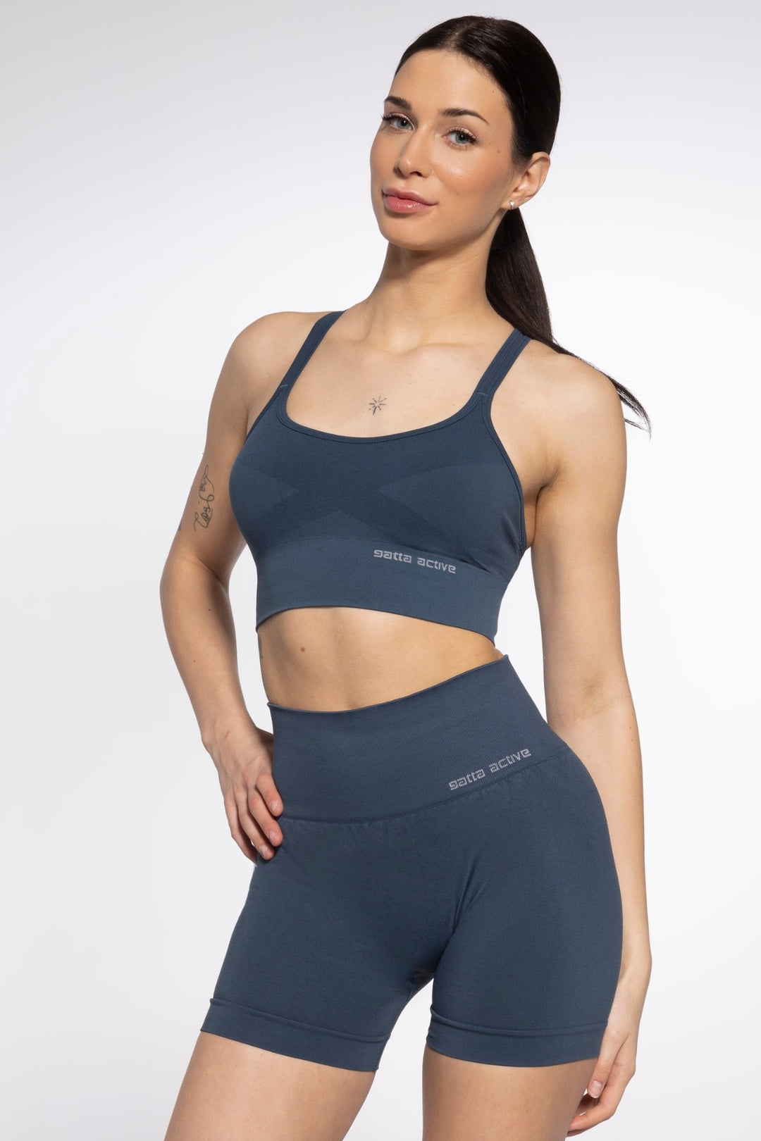 Model in blue active seamless sport shorts styled for performance and comfort, with sculpted seams and a snug, flattering fit