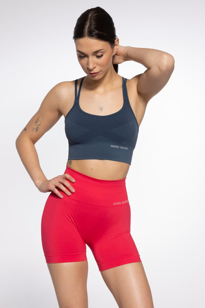 Close-up of red seamless sport shorts designed for high mobility and support, featuring a smooth finish and breathable stretch fabric