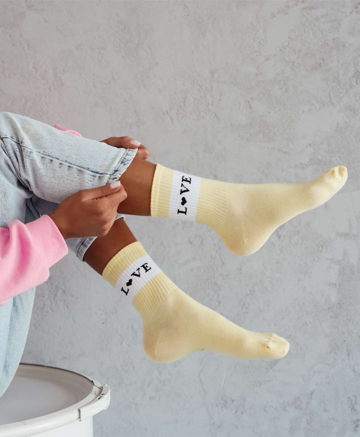 Women’s yellow breathable cotton ankle socks with love pattern. Soft, durable cotton socks ideal for daily comfort and casual styling