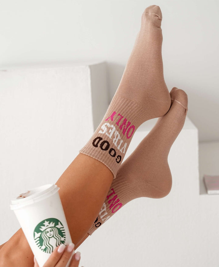 Women’s beige ankle socks with “Good Vibes Only” print. Soft, breathable cotton for everyday comfort and style