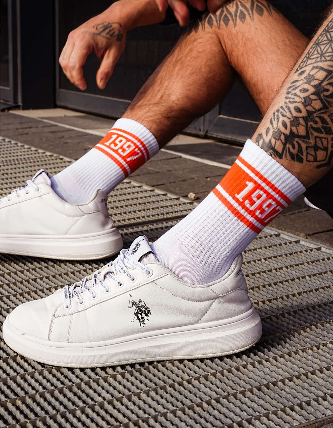 White athletic socks with orange 1997 print and elastic ribbed cuffs that don’t cause pressure
