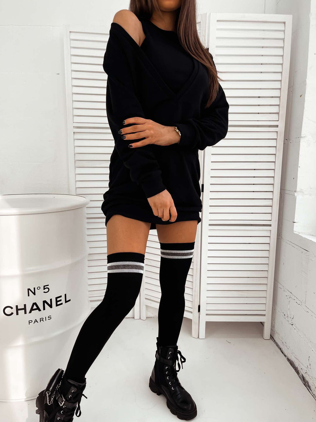 Women’s black over-the-knee socks featuring glittering lurex stripes and breathable cotton fabric