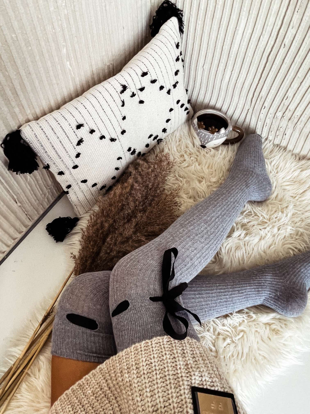 Light melange openwork over knee socks with elegant ribbon tie, perfect for adding a feminine touch to any outfit