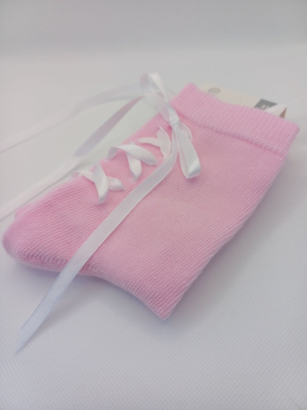 Pink laced socks with ribbon heel detail for women, soft cotton blend ideal for romantic, playful, and casual wear